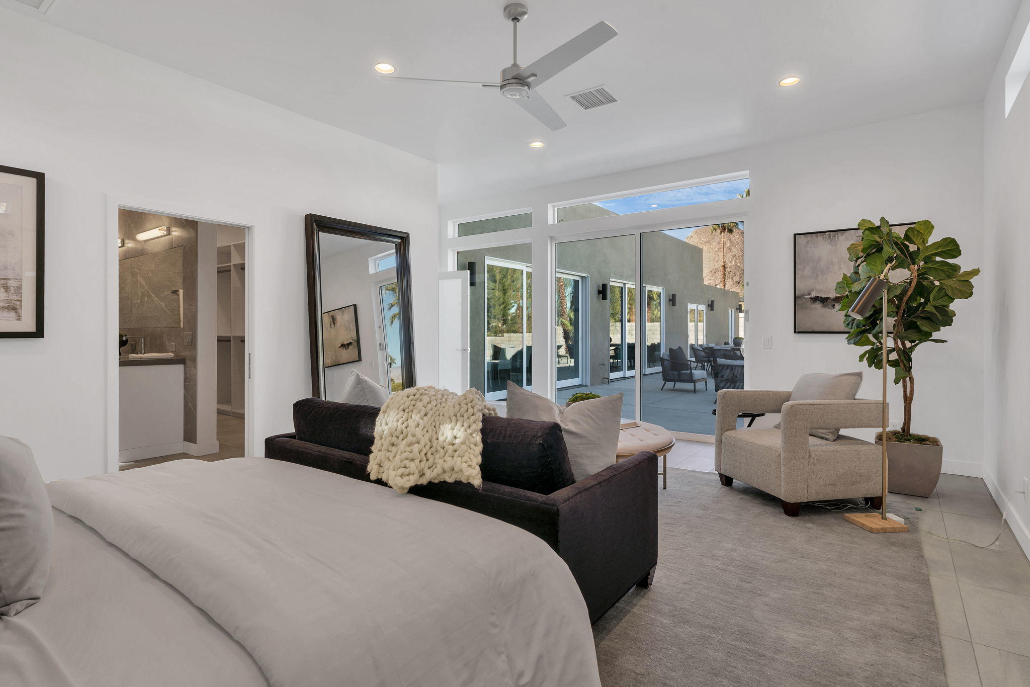 71374 Biskra Road Rancho Mirage, CA 92270 - Photo 27 of 75 a living room with furniture and a potted plant