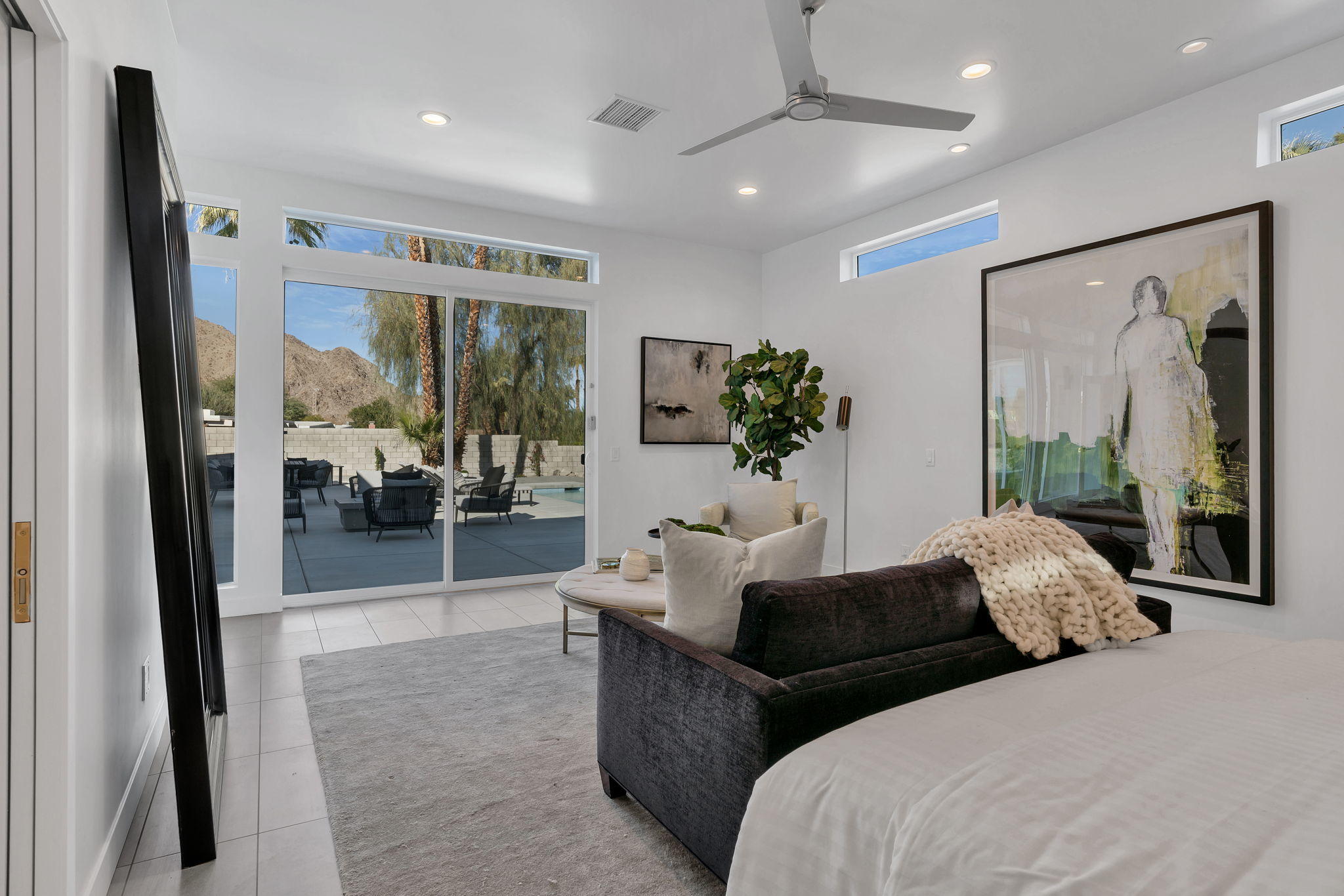 71374 Biskra Road Rancho Mirage, CA 92270 - Photo 28 of 75 a large bedroom with bed and glass door