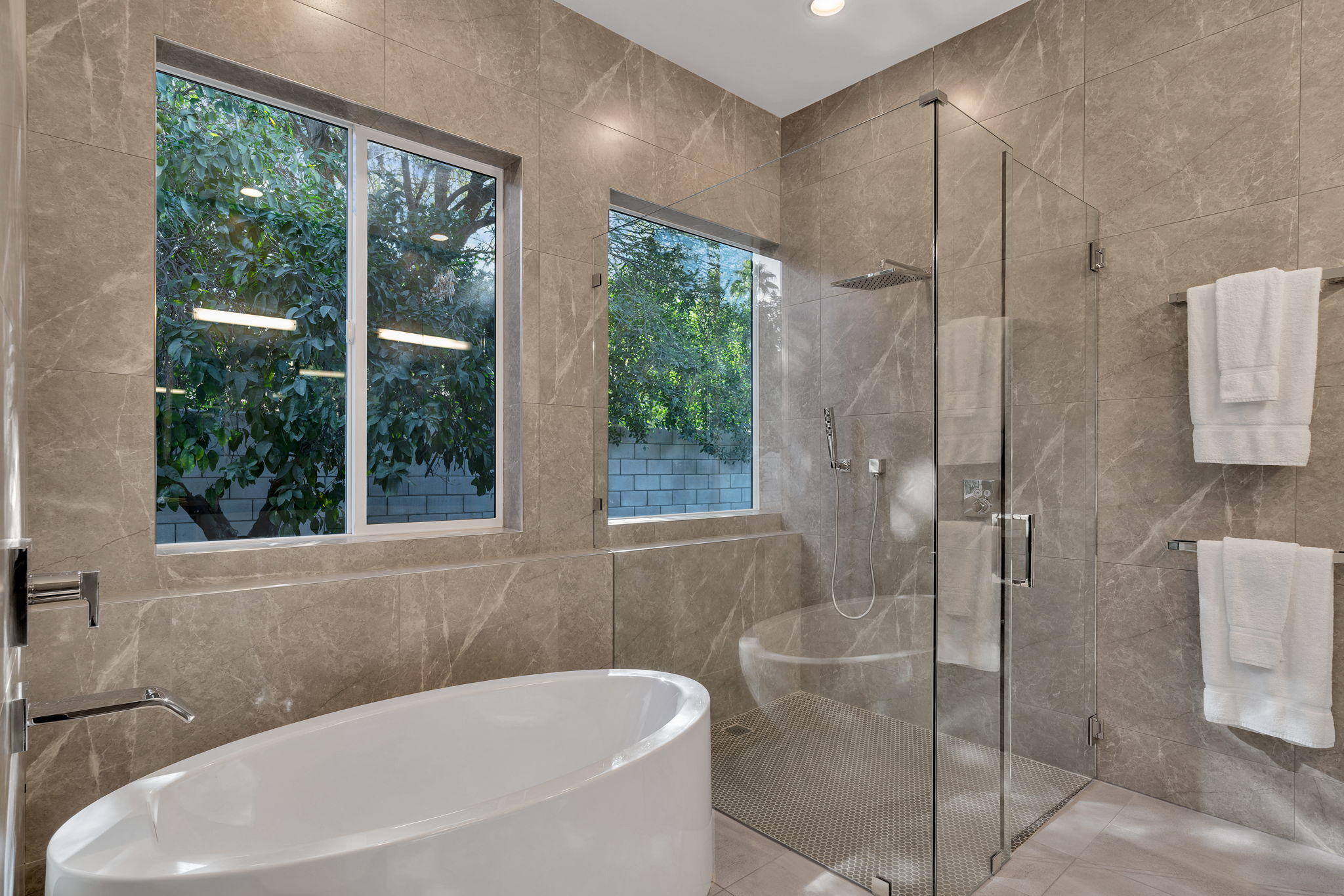 71374 Biskra Road Rancho Mirage, CA 92270 - Photo 29 of 75 a bathroom with a bathtub and shower