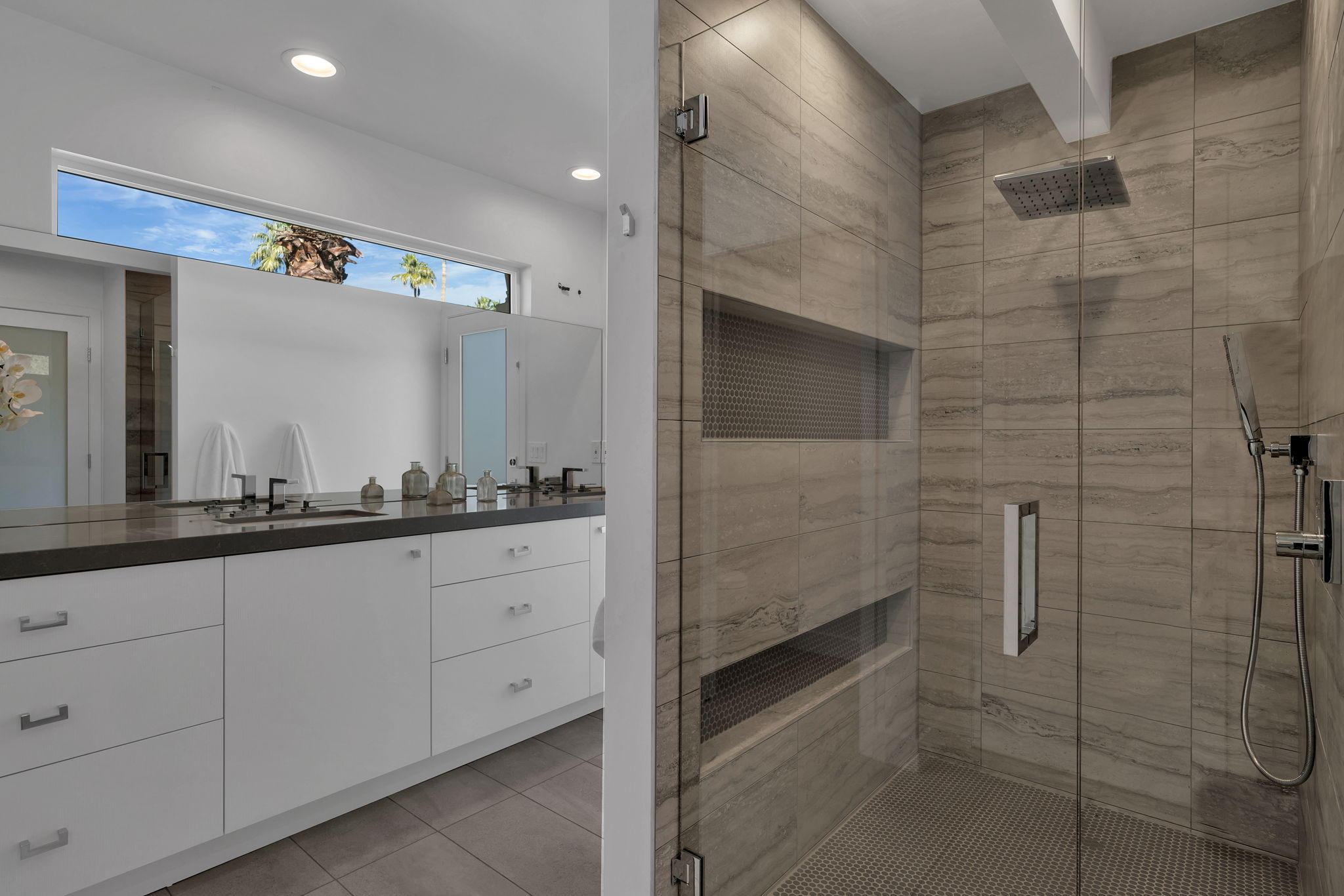 71374 Biskra Road Rancho Mirage, CA 92270 - Photo 39 of 75 a bathroom with a granite countertop sink and a mirror