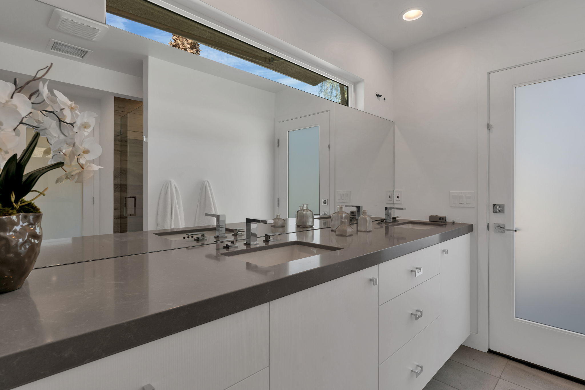 71374 Biskra Road Rancho Mirage, CA 92270 - Photo 40 of 75 a bathroom with a sink and a mirror