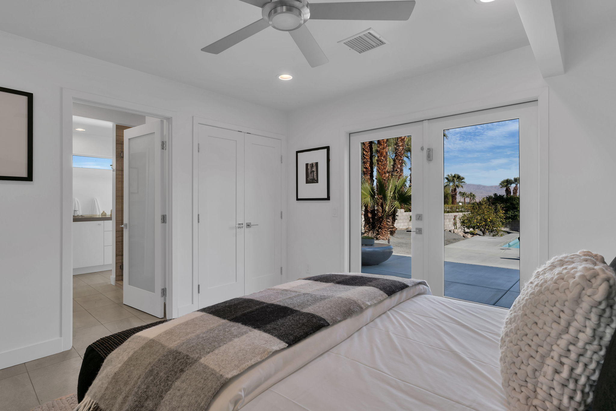 71374 Biskra Road Rancho Mirage, CA 92270 - Photo 41 of 75 a bedroom with a large bed and a window