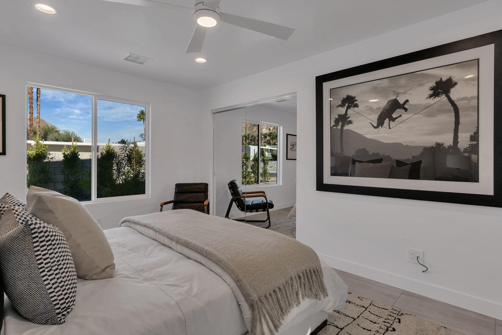 71374 Biskra Road Rancho Mirage, CA 92270 - Photo 42 of 75 a bedroom with a bed and a painting on the wall