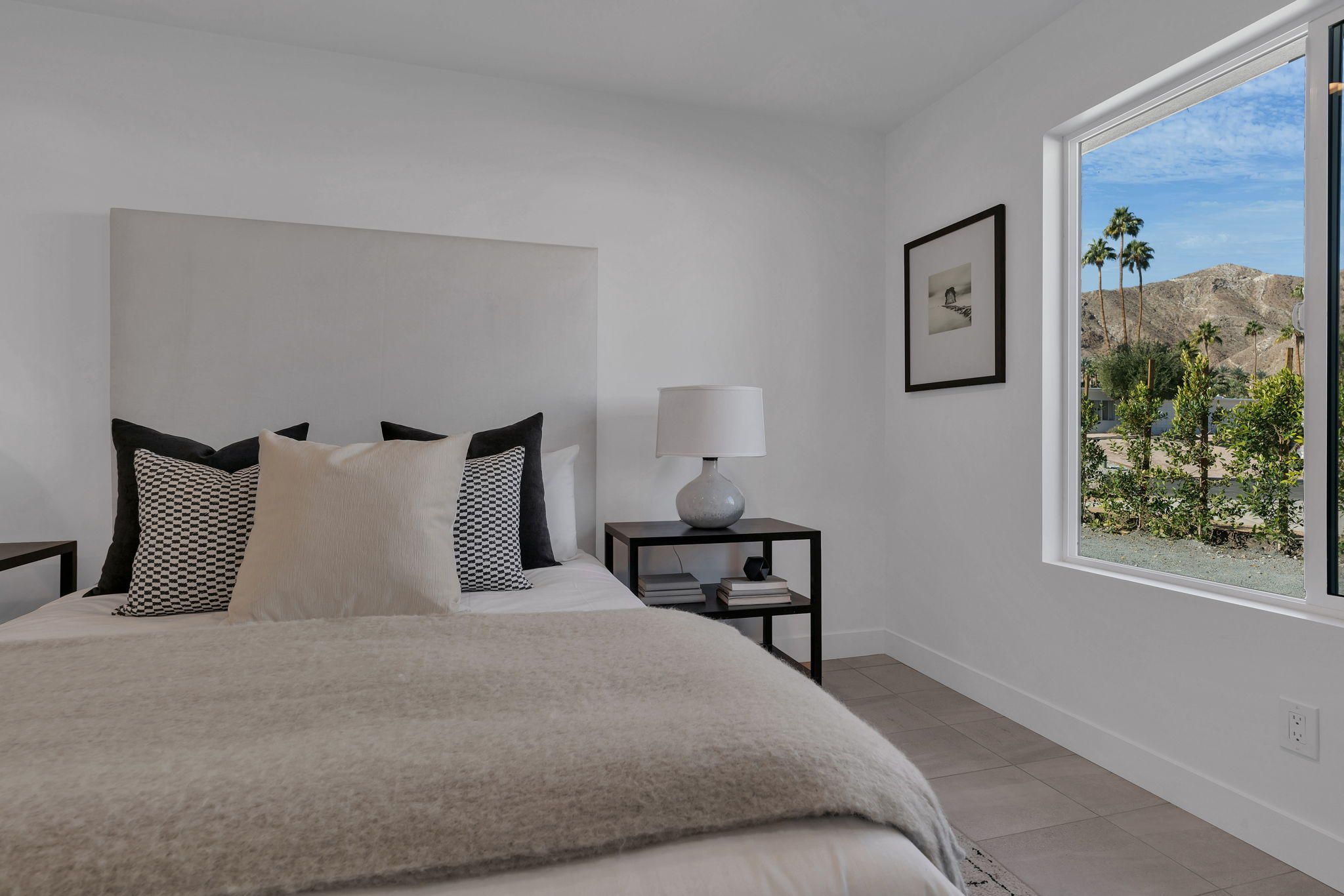 71374 Biskra Road Rancho Mirage, CA 92270 - Photo 43 of 75 a bedroom with bed and night stand
