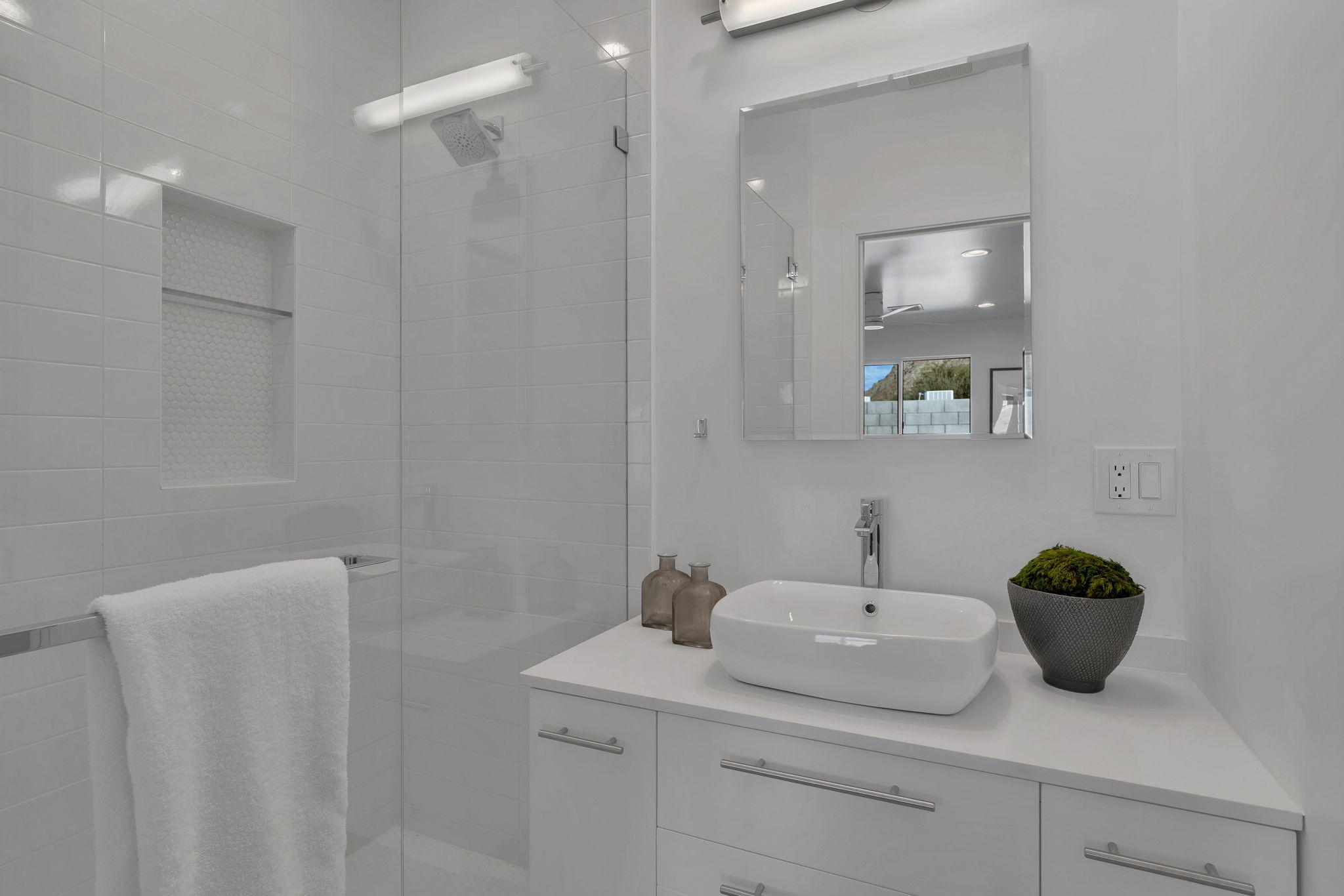 71374 Biskra Road Rancho Mirage, CA 92270 - Photo 44 of 75 a bathroom with a sink a light fixture and a mirror