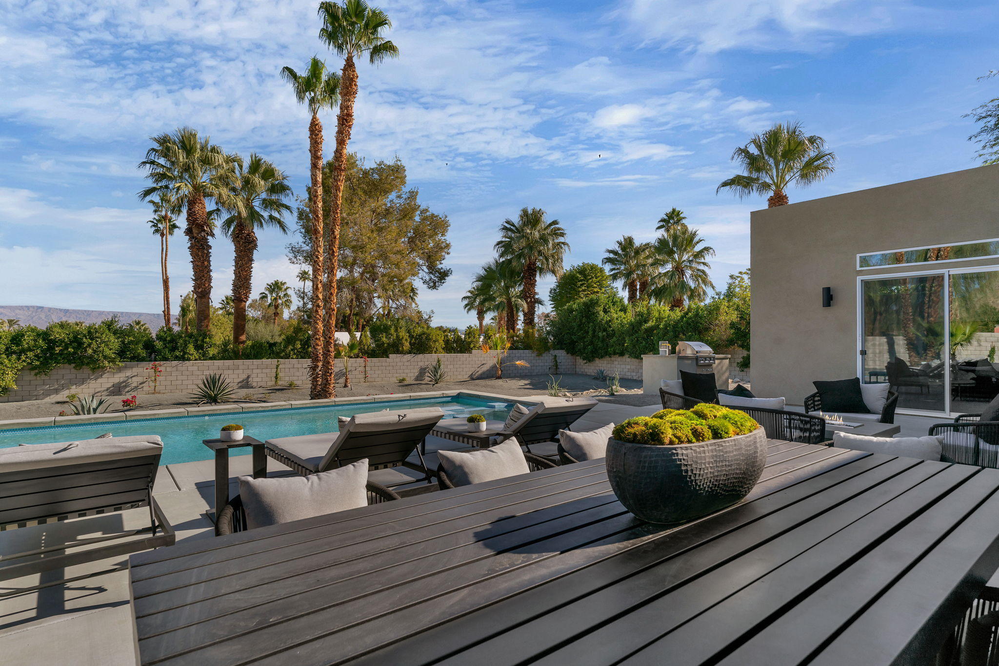 71374 Biskra Road Rancho Mirage, CA 92270 - Photo 53 of 75 a view of a roof deck with couches and a fire pit