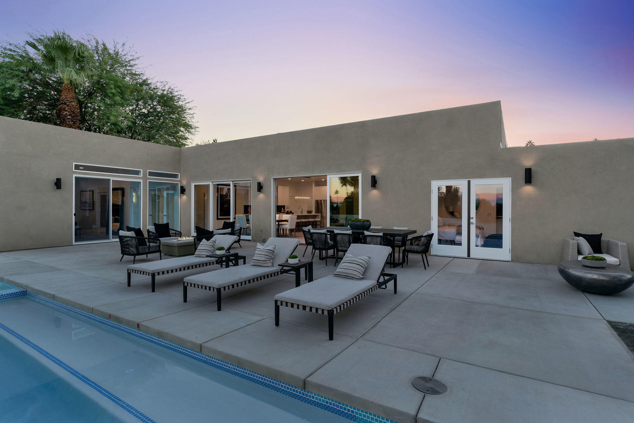 71374 Biskra Road Rancho Mirage, CA 92270 - Photo 59 of 75 a view of a patio with couches and potted plants