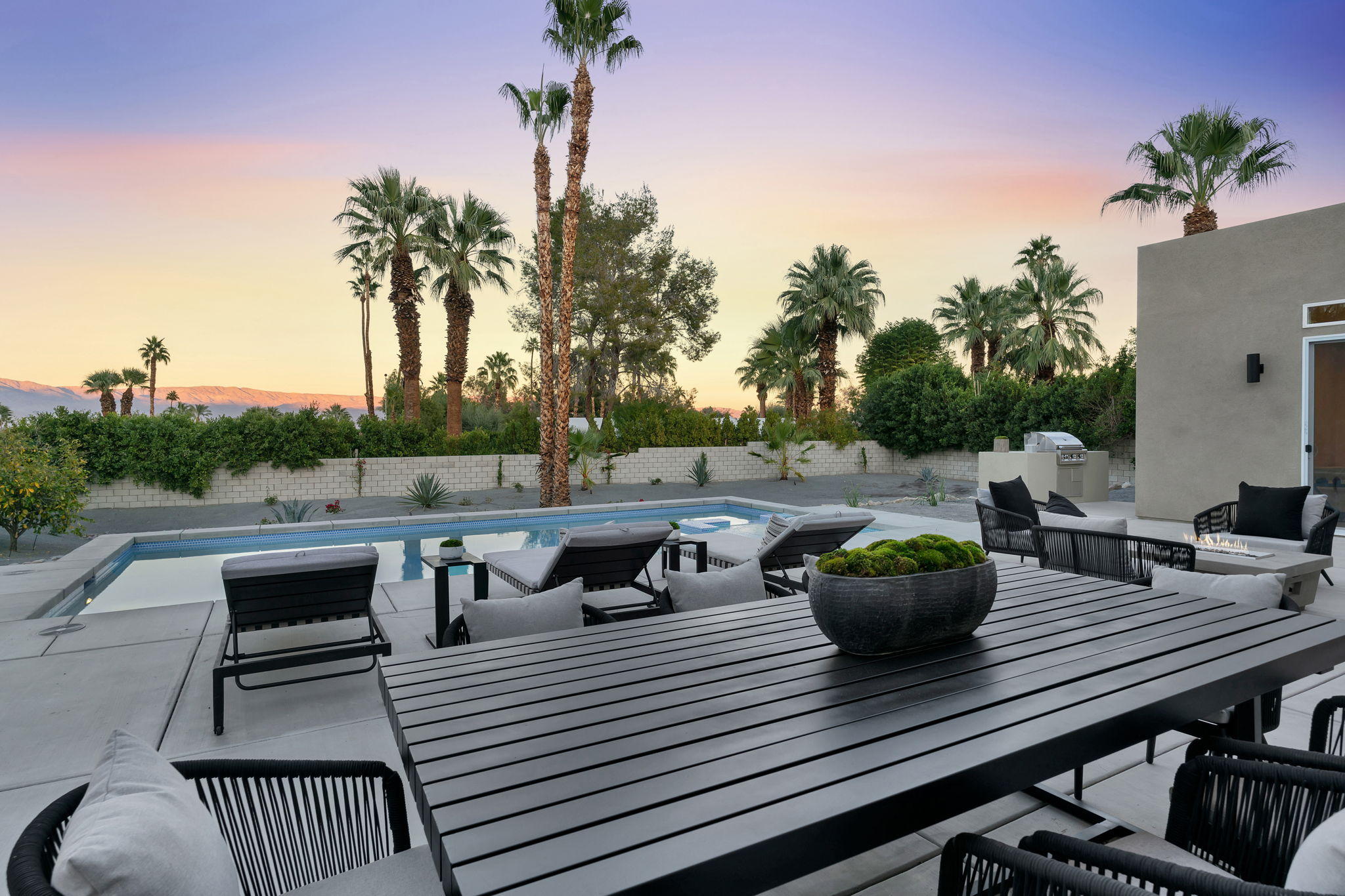 71374 Biskra Road Rancho Mirage, CA 92270 - Photo 62 of 75 a view of a roof deck with couches and potted plants
