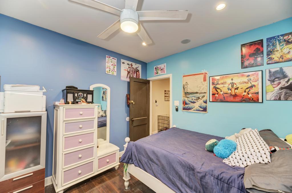 1941 North Harding Avenue Chicago, IL 60647 - Photo 11 of 44 a bedroom with a bed and furniture