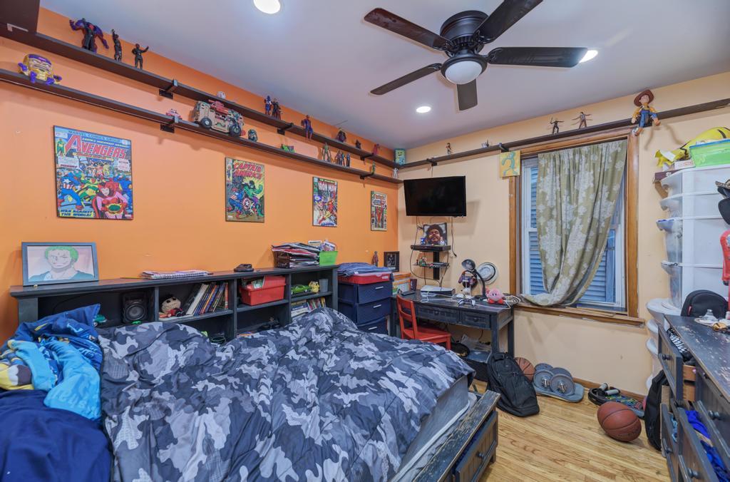 1941 North Harding Avenue Chicago, IL 60647 - Photo 12 of 44 a bed room with furniture and a window