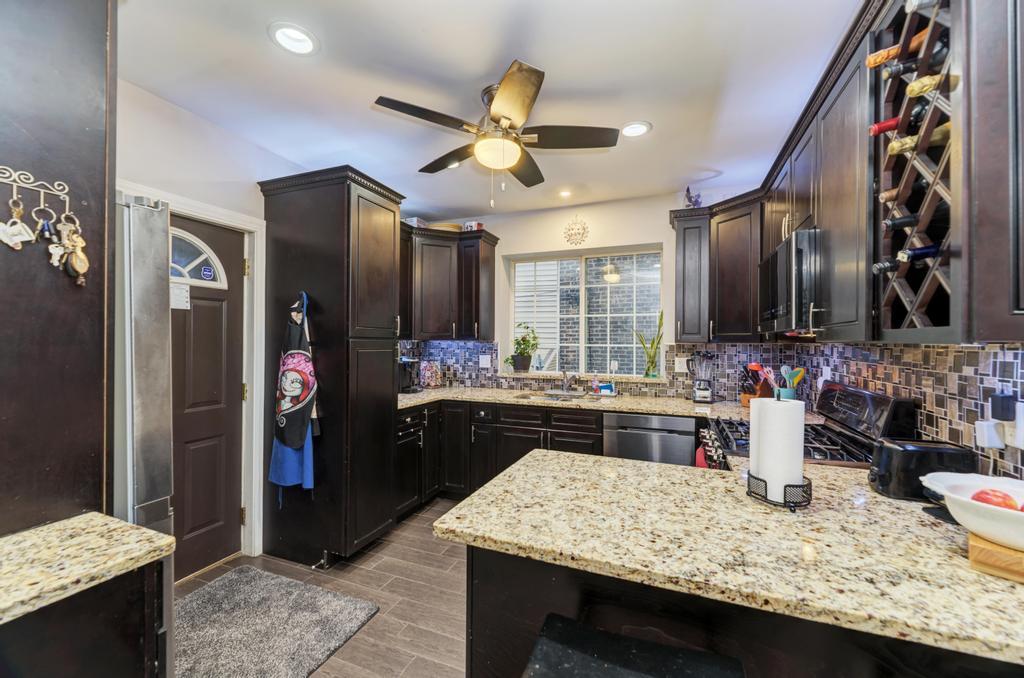 1941 North Harding Avenue Chicago, IL 60647 - Photo 17 of 44 a kitchen with a stove and a wooden cabinets