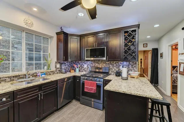 a kitchen with a sink and a refrigerator