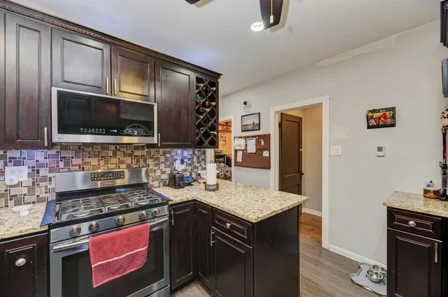 a kitchen with a stove and a microwave