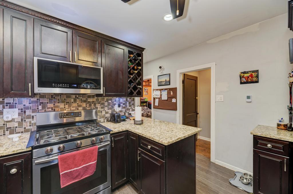 1941 North Harding Avenue Chicago, IL 60647 - Photo 20 of 44 a kitchen with a stove and a microwave