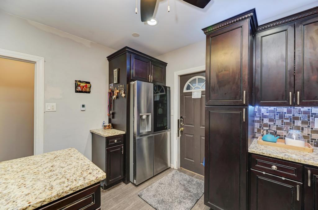 1941 North Harding Avenue Chicago, IL 60647 - Photo 21 of 44 a kitchen with stainless steel appliances granite countertop a refrigerator and a stove