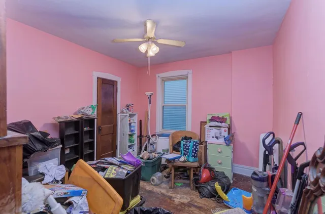 a bedroom with furniture and a chandelier