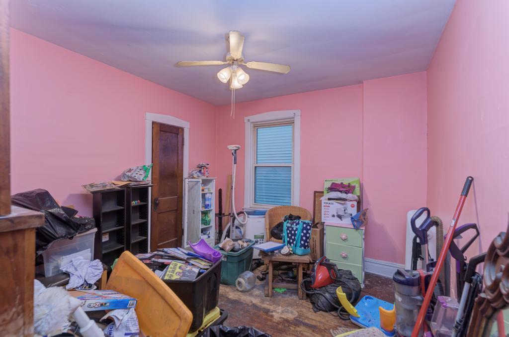 1941 North Harding Avenue Chicago, IL 60647 - Photo 26 of 44 a bedroom with furniture and a chandelier