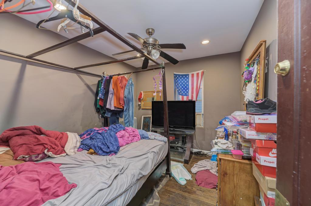 1941 North Harding Avenue Chicago, IL 60647 - Photo 27 of 44 a bedroom with a bed and a flat screen tv