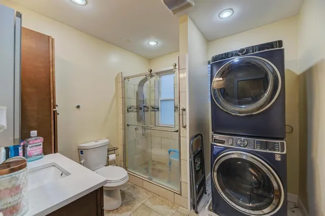 a bathroom with a sink mirror and toilet