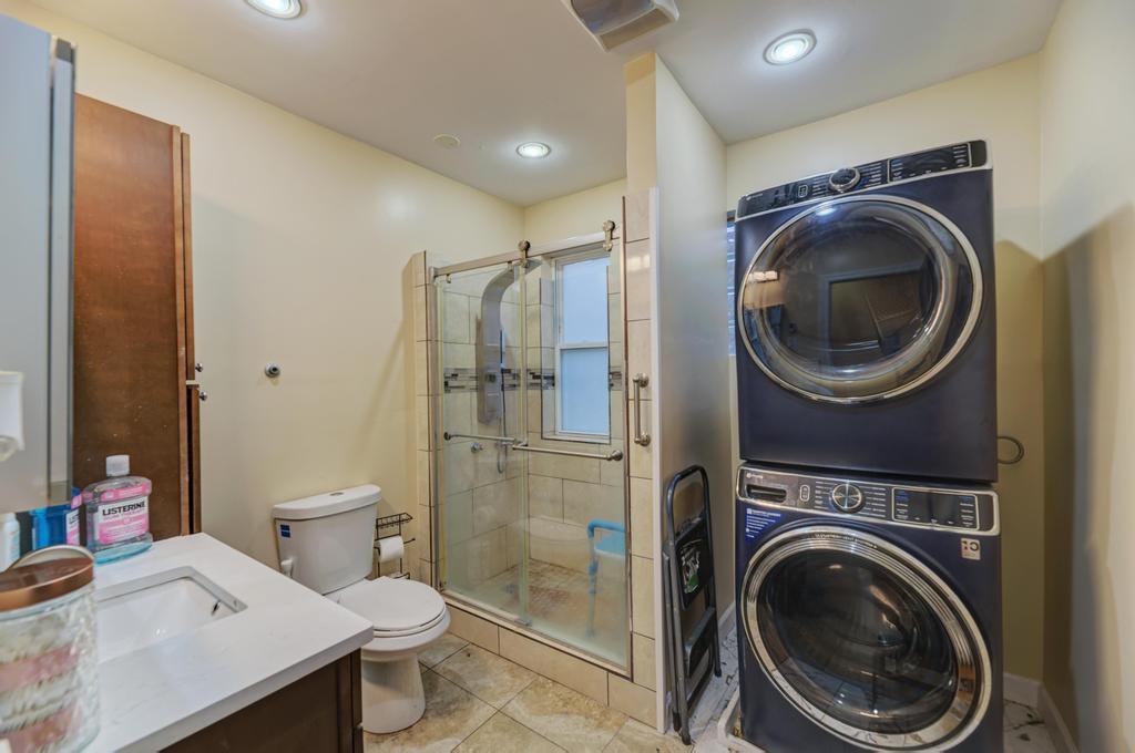 1941 North Harding Avenue Chicago, IL 60647 - Photo 28 of 44 a bathroom with a sink mirror and toilet