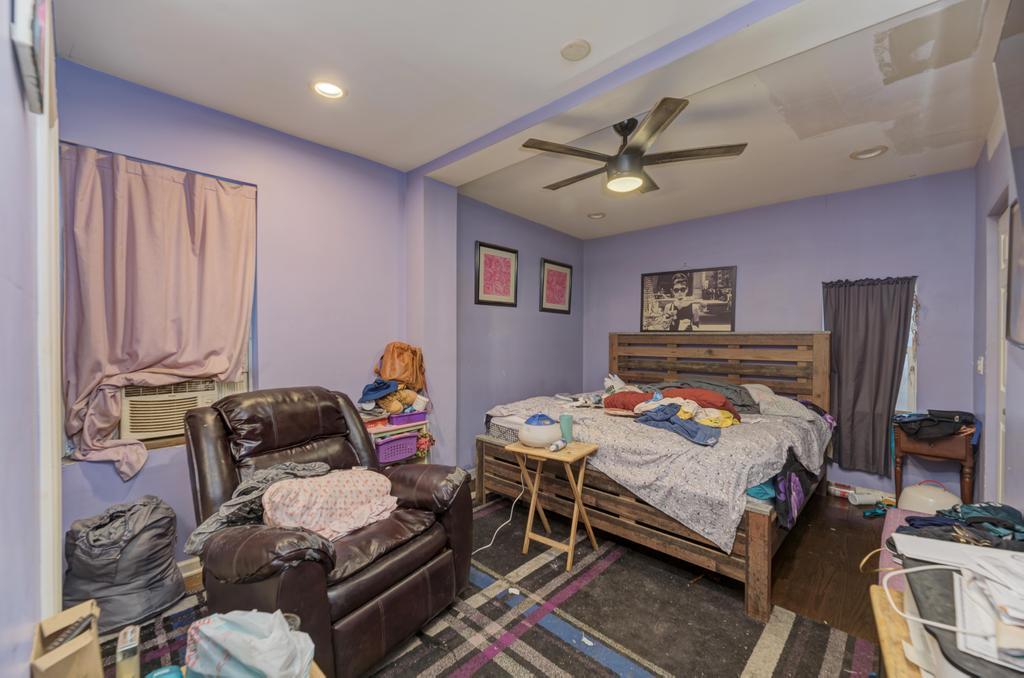 1941 North Harding Avenue Chicago, IL 60647 - Photo 32 of 44 a bedroom with furniture and a chandelier