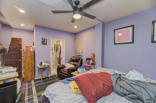 a bedroom with furniture and a chandelier