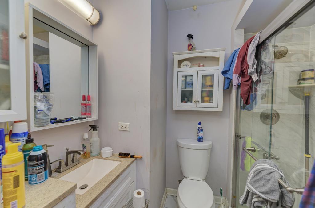 1941 North Harding Avenue Chicago, IL 60647 - Photo 34 of 44 a bathroom with a sink toilet and shower
