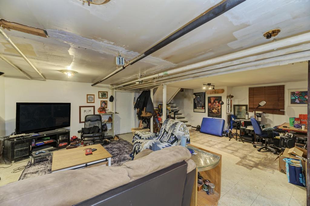 1941 North Harding Avenue Chicago, IL 60647 - Photo 36 of 44 a room with lots of furniture and clutter