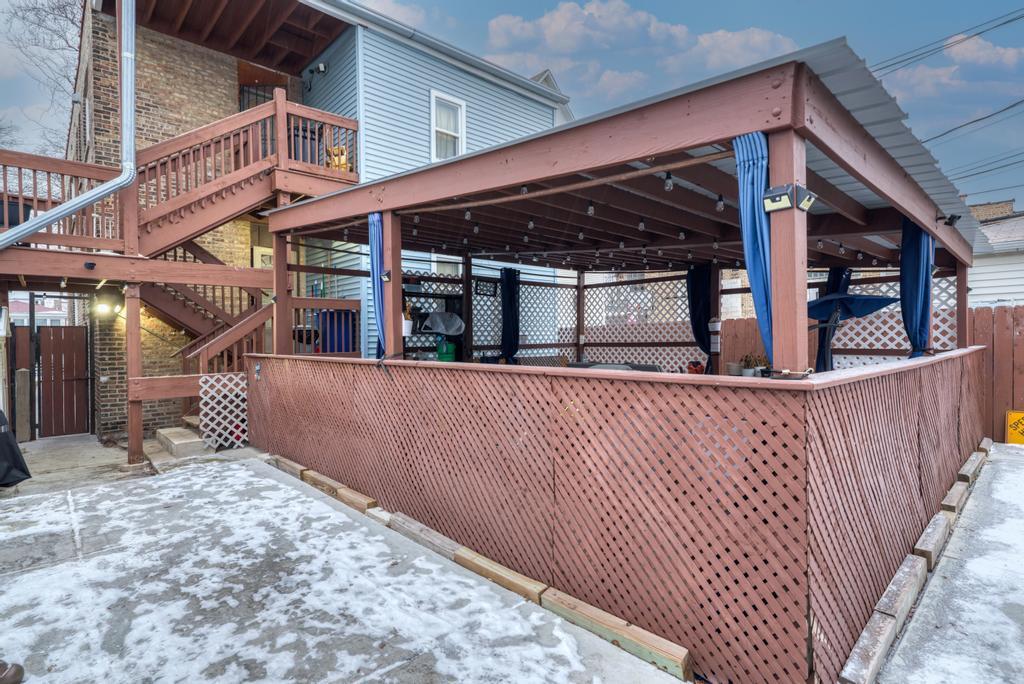 1941 North Harding Avenue Chicago, IL 60647 - Photo 43 of 44 front view of a house with a balcony
