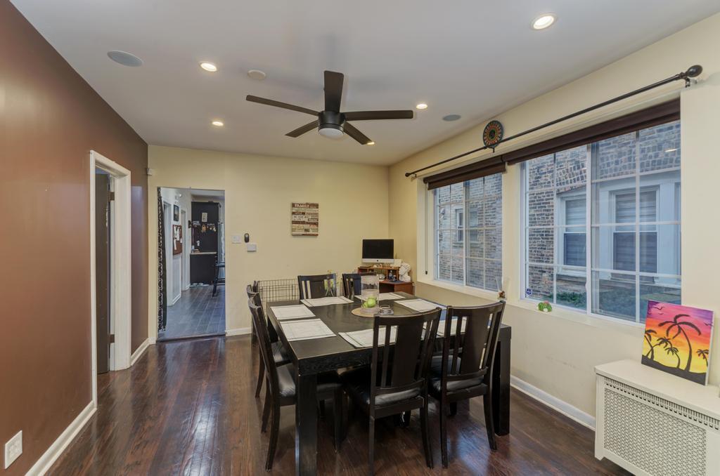 1941 North Harding Avenue Chicago, IL 60647 - Photo 8 of 44 a view of a dining room with furniture window and wooden floor