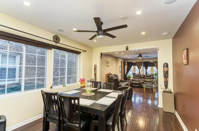 a view of a dining room with furniture window and wooden floor