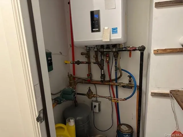 a bathroom with a sink toilet and mirror