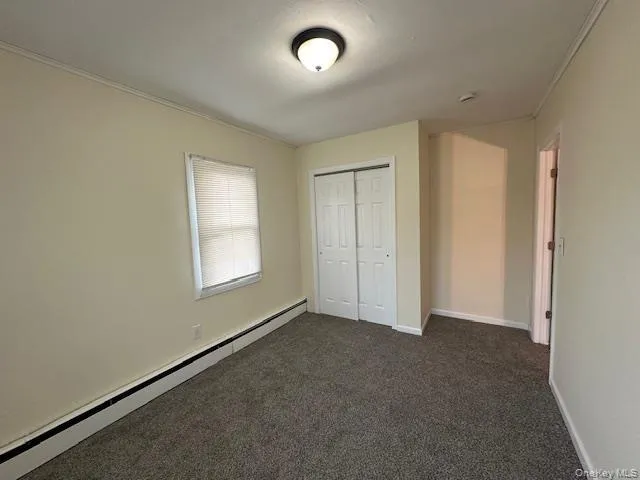 an empty room with a empty space and windows