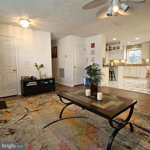 a kitchen with a table and chairs in it