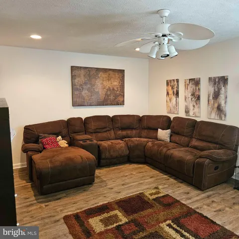 a living room with furniture and a rug