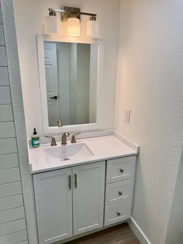 a bathroom with a sink and a mirror