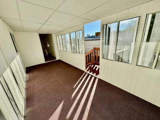 a view of an empty room with a window
