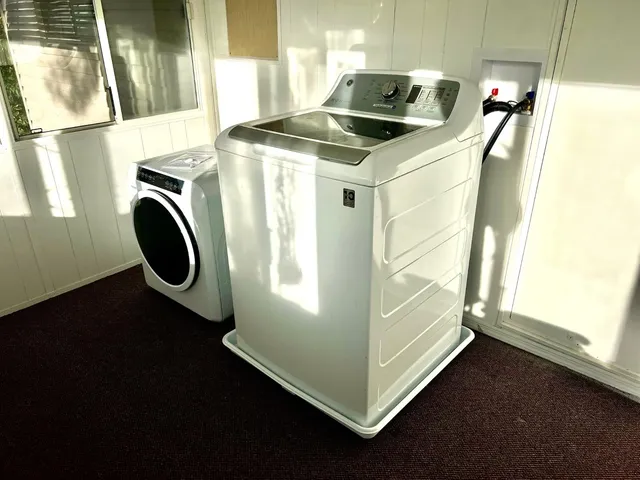 a utility room with dryer and washer