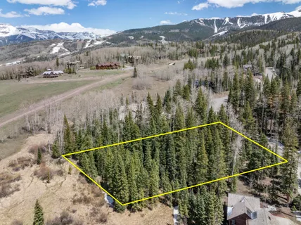a view of a balcony with a forest view