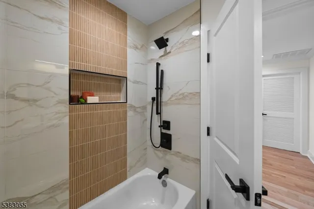 a bathroom with a sink and shower