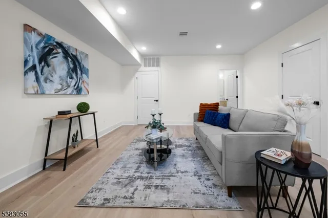 a living room with furniture and a rug