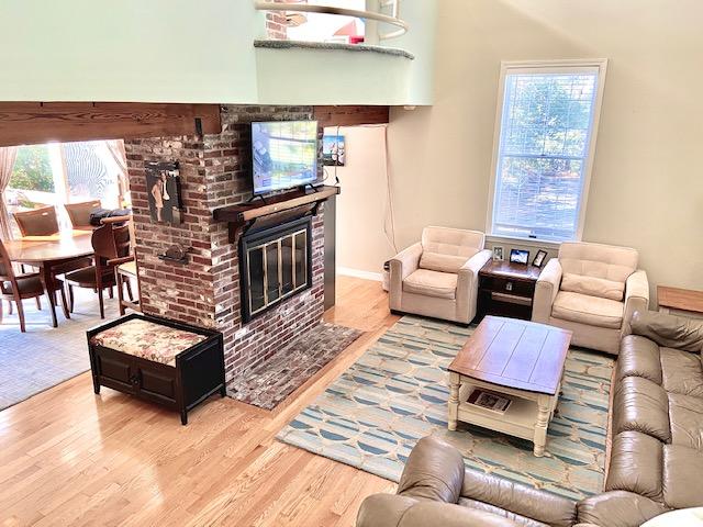8 Sumner Lane Brewster, MA 02631 - Photo 13 of 43 a living room with furniture and a fireplace