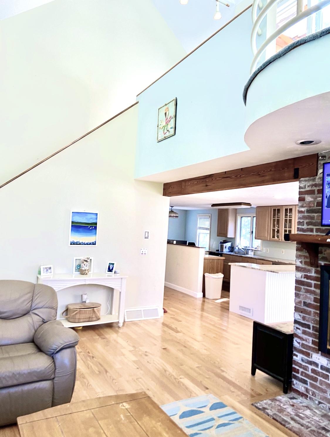 8 Sumner Lane Brewster, MA 02631 - Photo 15 of 43 a living room with furniture and a wooden floor