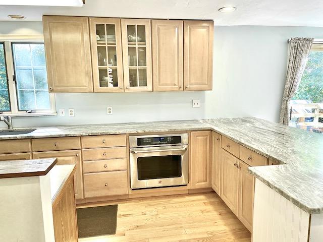 8 Sumner Lane Brewster, MA 02631 - Photo 16 of 43 a kitchen with stainless steel appliances granite countertop a sink and a stove top oven