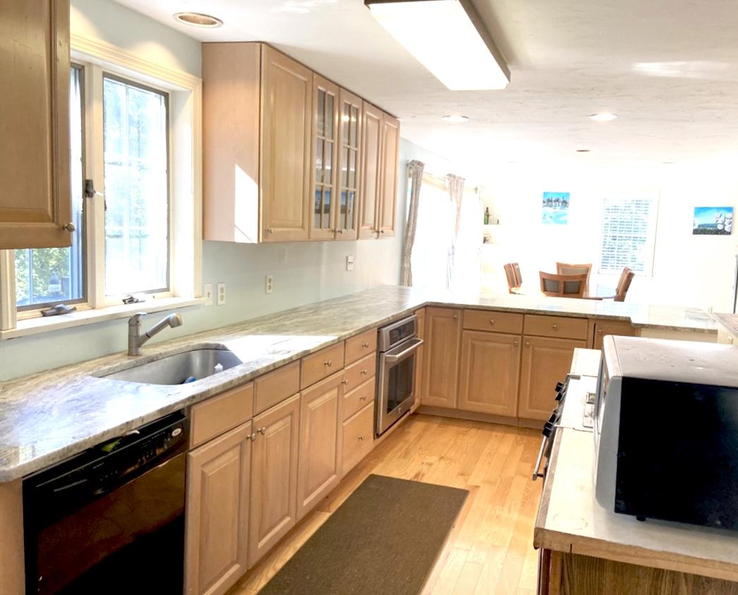 8 Sumner Lane Brewster, MA 02631 - Photo 17 of 43 a kitchen with a sink a window and cabinets