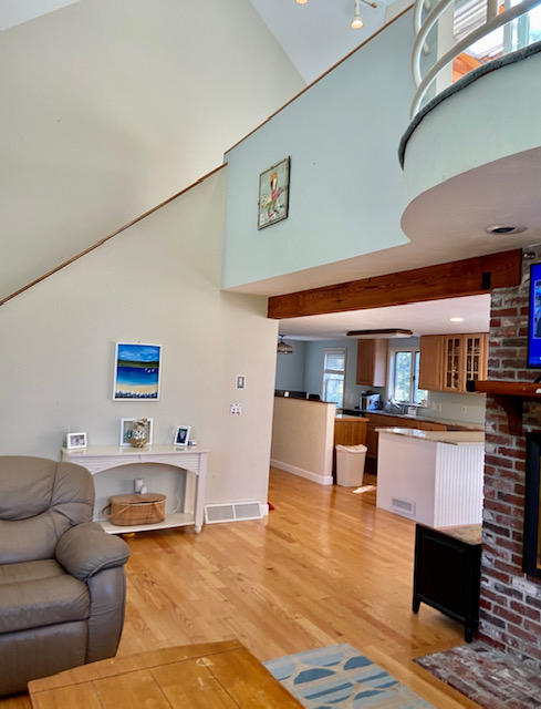 8 Sumner Lane Brewster, MA 02631 - Photo 18 of 43 a living room with furniture and a wooden floor