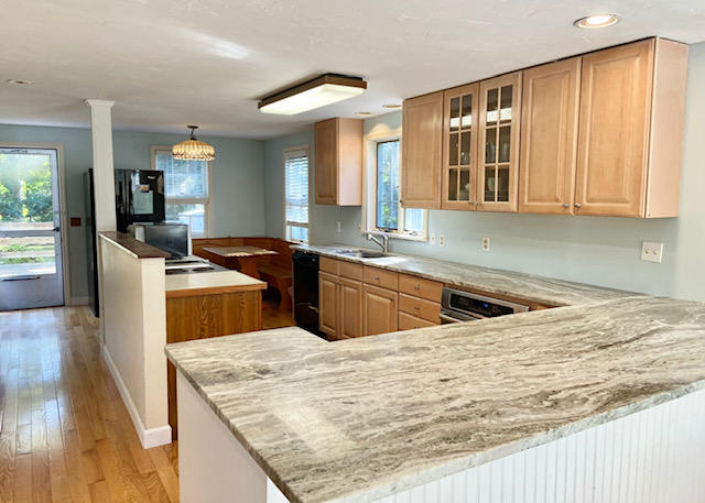 8 Sumner Lane Brewster, MA 02631 - Photo 19 of 43 a kitchen with stainless steel appliances kitchen island granite countertop a sink and cabinets