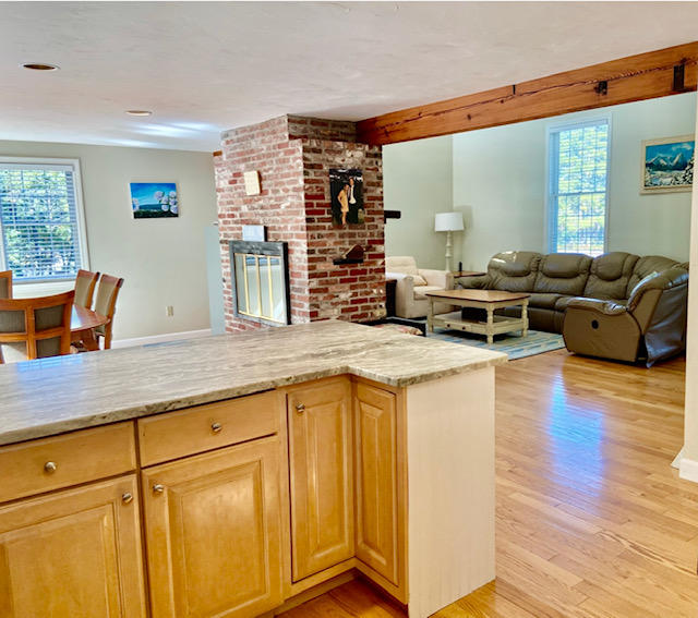 8 Sumner Lane Brewster, MA 02631 - Photo 21 of 43 a kitchen with stainless steel appliances granite countertop a stove and a wooden floors