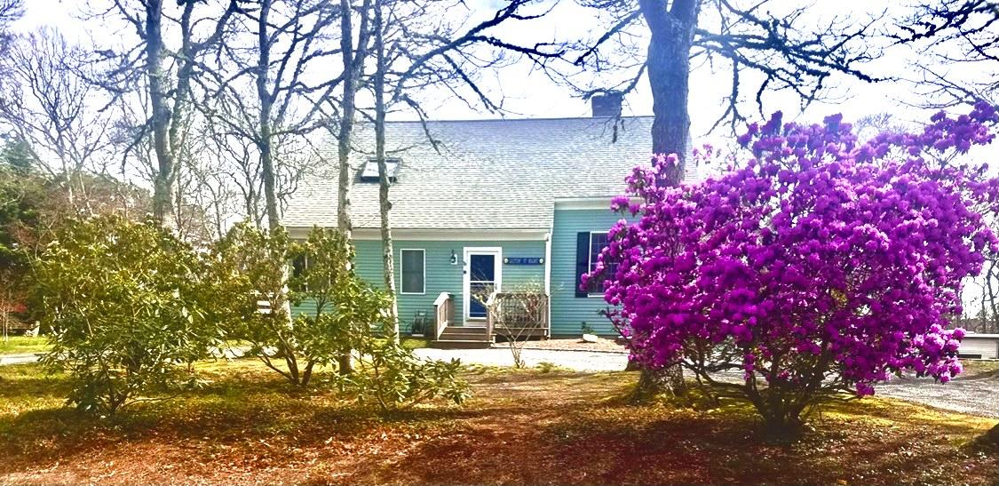 8 Sumner Lane Brewster, MA 02631 - Photo 6 of 43 a view of a house with a tree in a yard