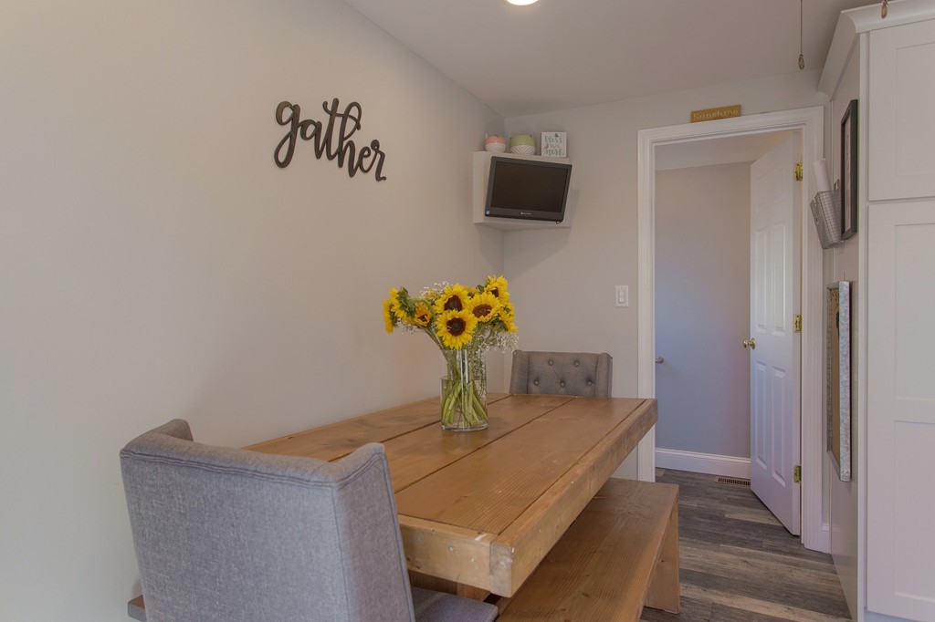 13 Golf Avenue, Unit 13 Methuen, MA 01844 - Photo 11 of 30 a living room with furniture and a flat screen tv